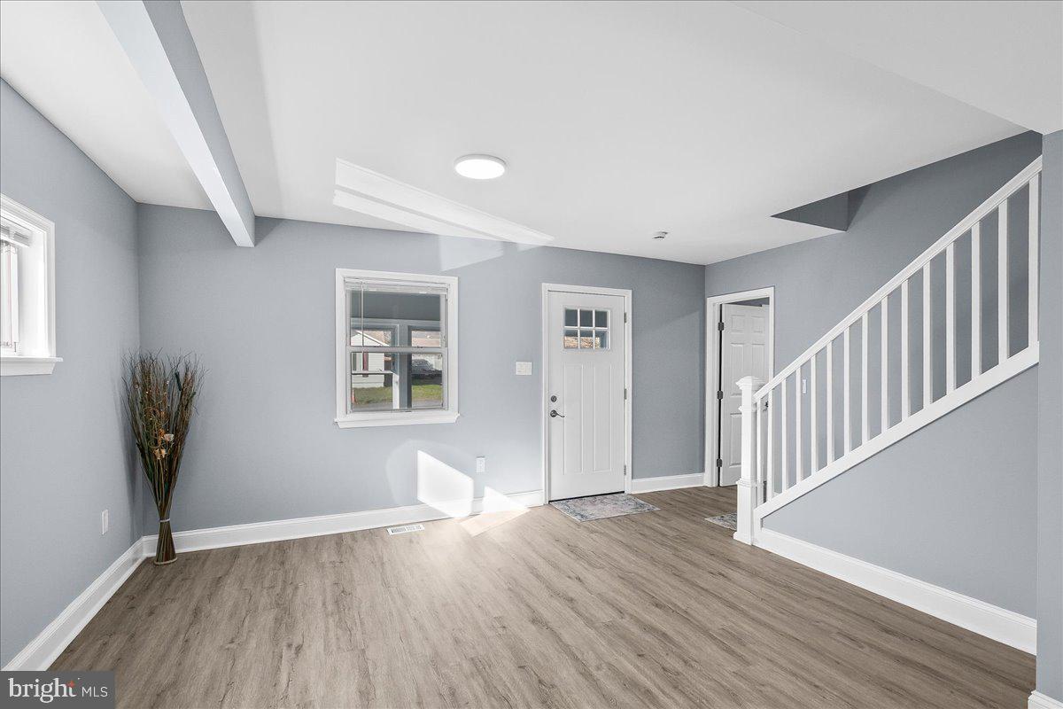 57 Transverse Avenue Middle River, MD 21220 - Photo 9 of 35 wooden floor in an empty room with a window