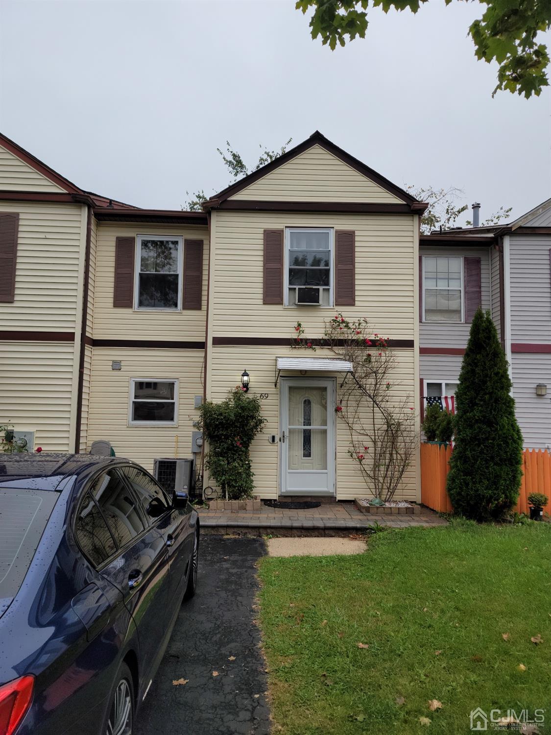 69 Redbud Road Piscataway, NJ 08854 - Photo 2 of 3 a front view of a house with garden