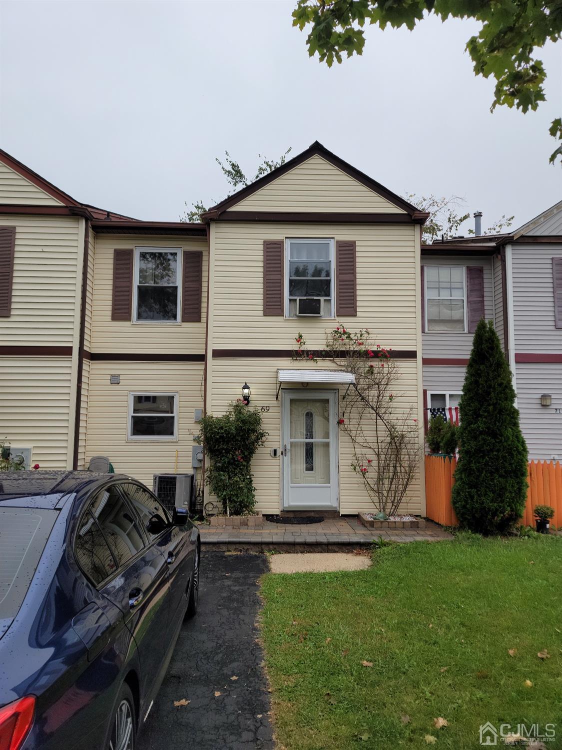 69 Redbud Road Piscataway, NJ 08854 - Photo 3 of 3 a front view of a house with a garden