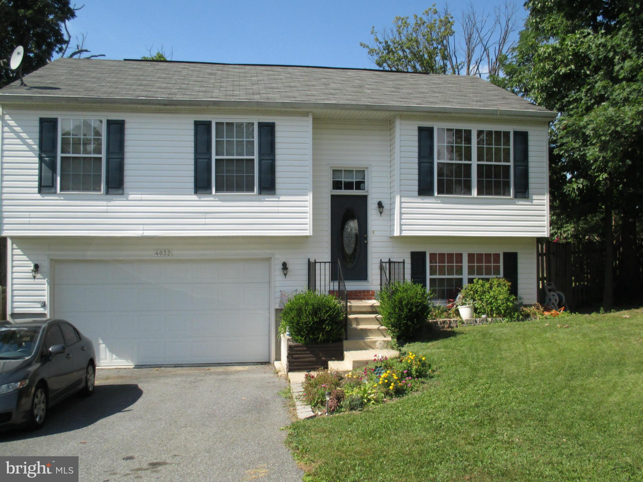 4032 Oak Road Halethorpe, MD 21227 - Photo 1 of 15 a front view of a house with garden
