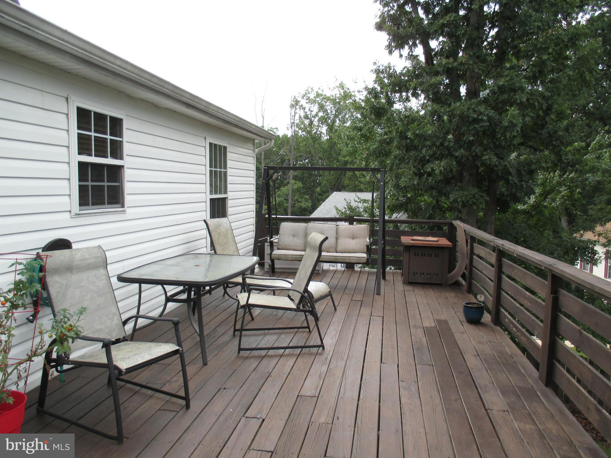 4032 Oak Road Halethorpe, MD 21227 - Photo 2 of 15 a view of balcony with wooden floor and outdoor seating
