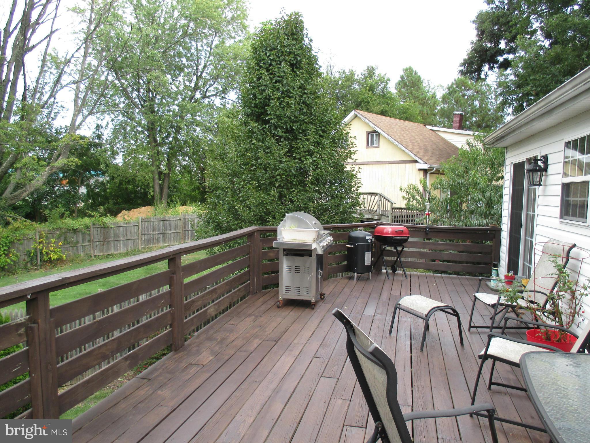 4032 Oak Road Halethorpe, MD 21227 - Photo 3 of 15 a view of deck with furniture and trees