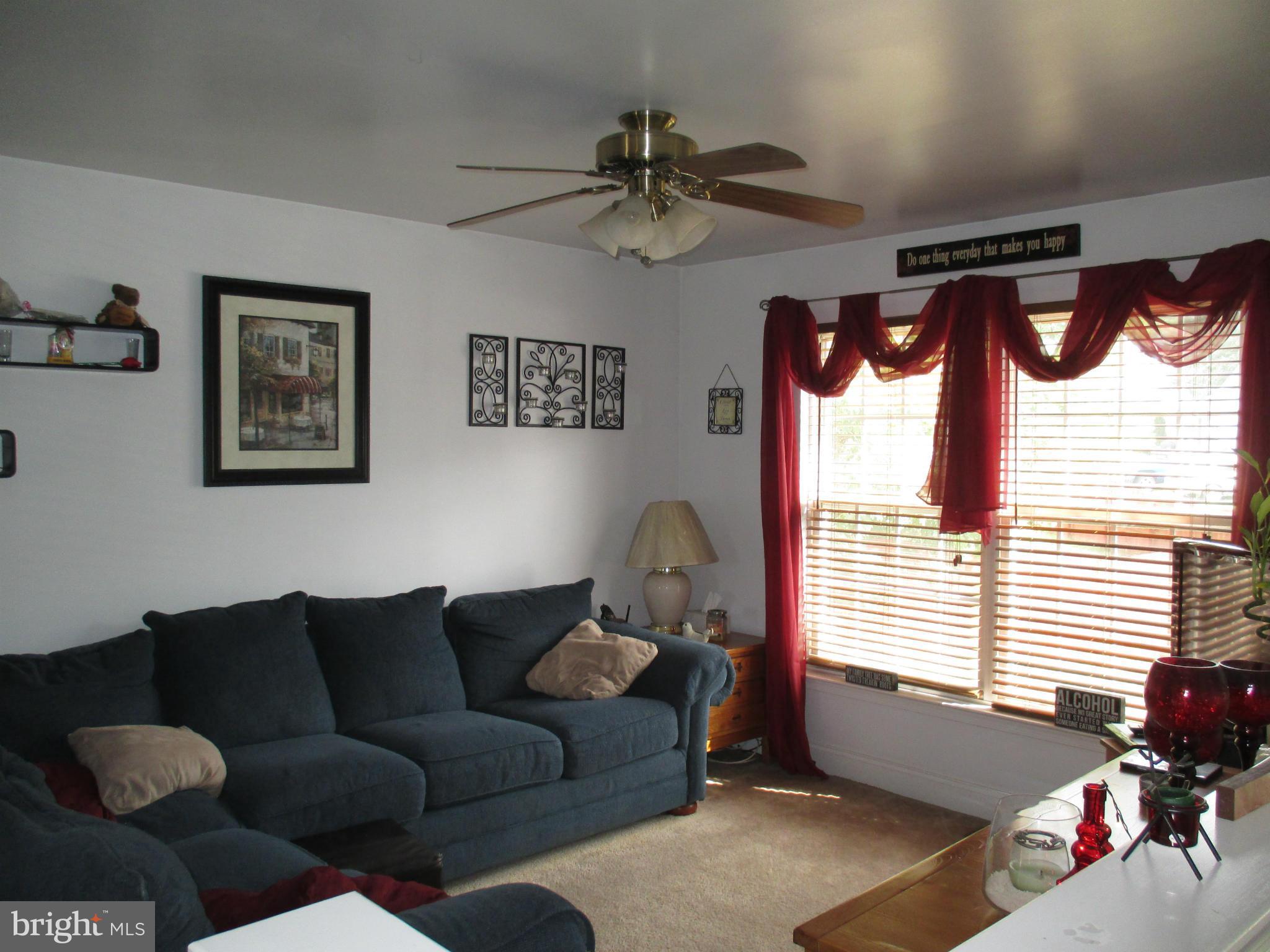 4032 Oak Road Halethorpe, MD 21227 - Photo 7 of 15 a living room with furniture and a window