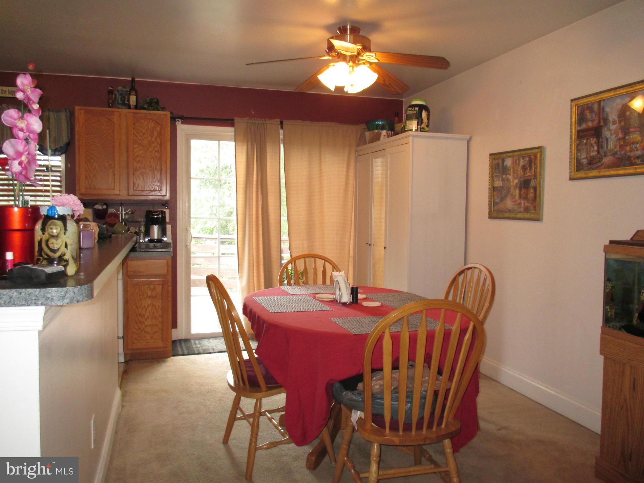 4032 Oak Road Halethorpe, MD 21227 - Photo 8 of 15 a view of a dining room with furniture and chandelier