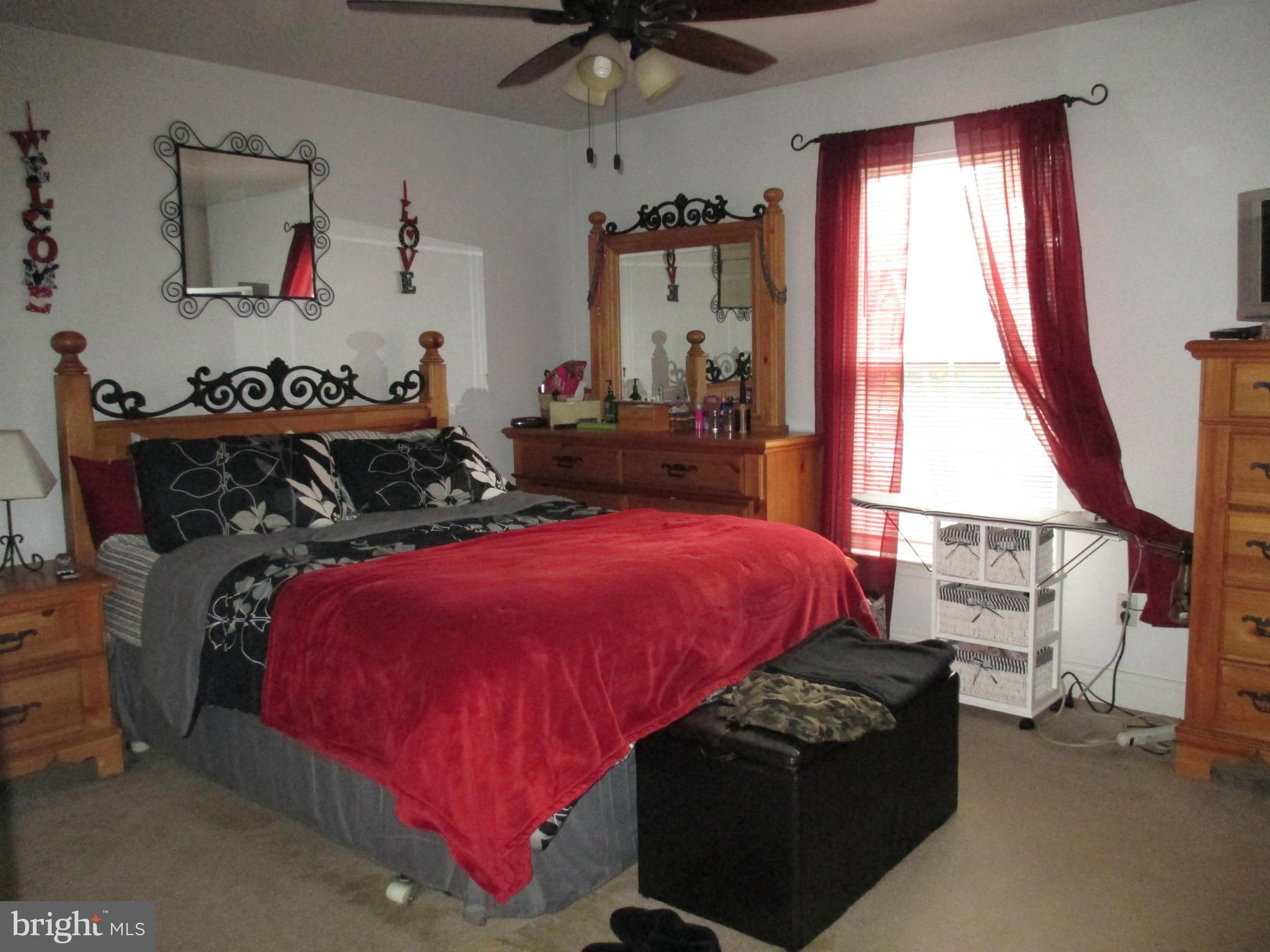 4032 Oak Road Halethorpe, MD 21227 - Photo 9 of 15 a bedroom with bed and a window