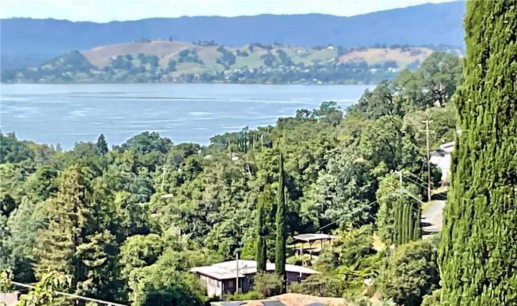 7282 Marin Street Nice, CA 95464 - Photo 1 of 69 Aerial perspective of the full 4-lot estate (7252–7282 Marin St) featuring the existing home, carport, and immense privacy. This rare vantage point highlights the proximity to Clearlake and the potential for expansive panoramic views with selective clearing.