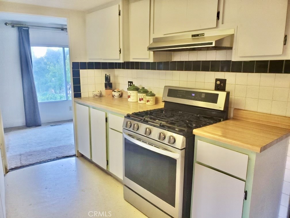7282 Marin Street Nice, CA 95464 - Photo 25 of 69 a kitchen with a stove and a refrigerator