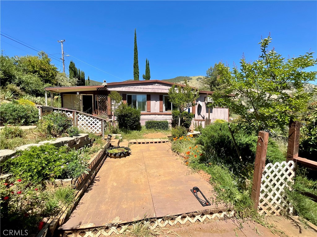 7282 Marin Street Nice, CA 95464 - Photo 32 of 69 a front view of a house with a garden