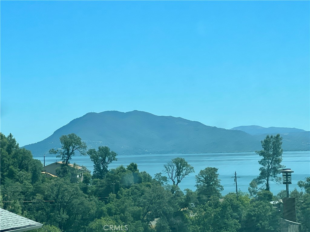 7282 Marin Street Nice, CA 95464 - Photo 33 of 69 a view of a lake with mountains in the background