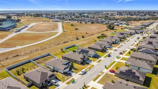 an aerial view of residential building with outdoor space
