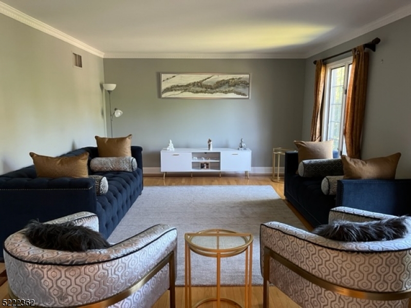 87 Highland Circle Berkeley Heights, NJ 07922 - Photo 3 of 11 a living room with furniture and a rug