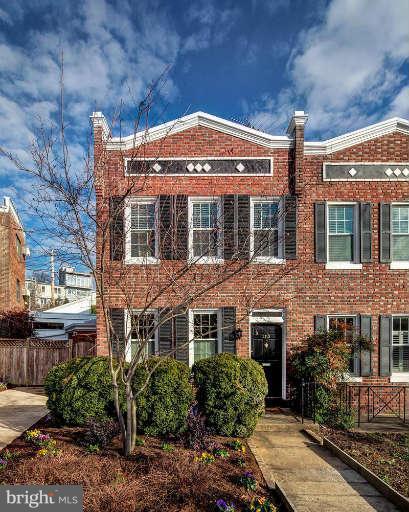 a front view of a building with garden