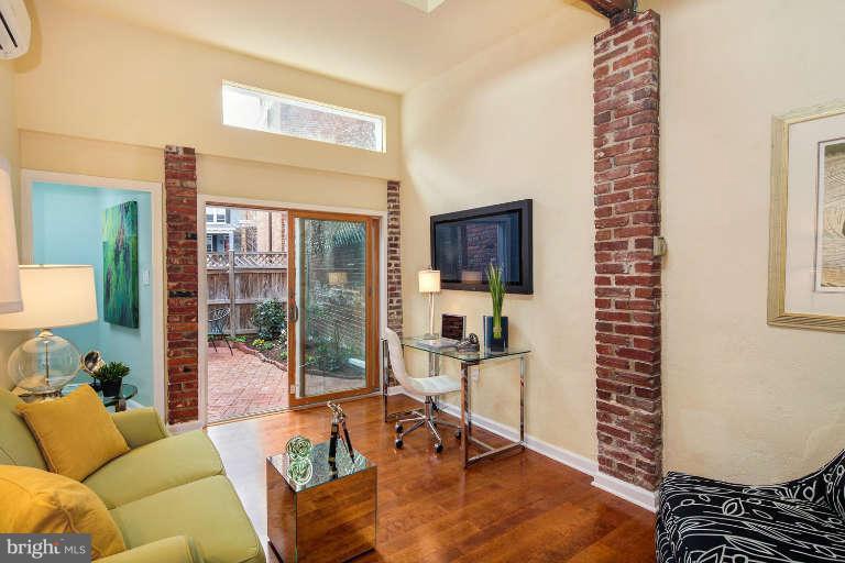 2113 37th Street Northwest Washington, DC 20007 - Photo 14 of 30 a living room with furniture and a window