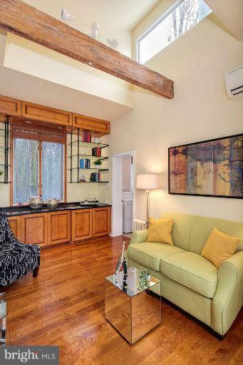 2113 37th Street Northwest Washington, DC 20007 - Photo 15 of 30 a living room with furniture and a table