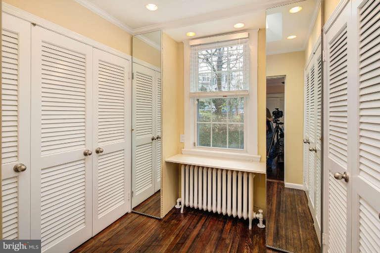 2113 37th Street Northwest Washington, DC 20007 - Photo 19 of 30 a view of a room with wooden floor and windows