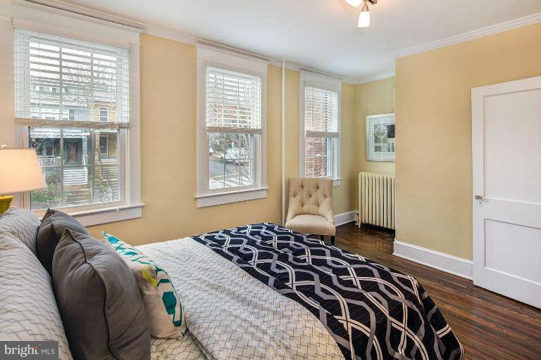 2113 37th Street Northwest Washington, DC 20007 - Photo 21 of 30 a bedroom with a bed and a window