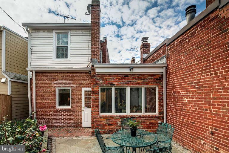 2113 37th Street Northwest Washington, DC 20007 - Photo 28 of 30 a front view of a house with a yard and garage