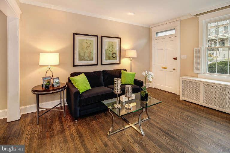 2113 37th Street Northwest Washington, DC 20007 - Photo 5 of 30 a living room with furniture and a wooden floor
