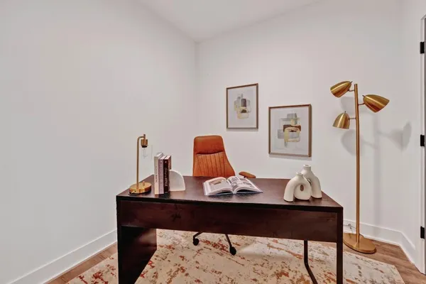 a view of a workspace with furniture