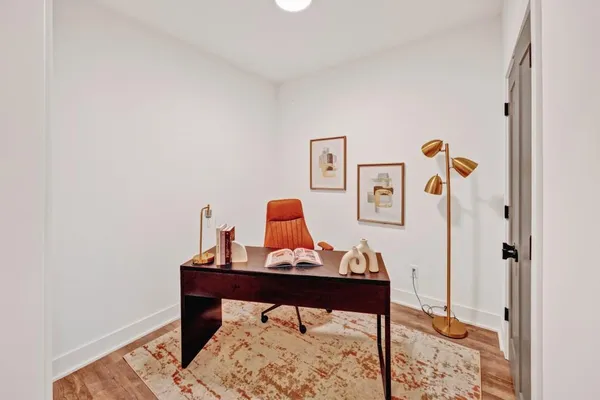 a view of a workspace with furniture