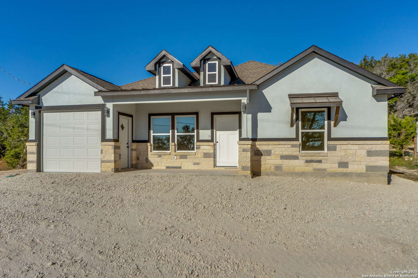 front view of a house with a yard
