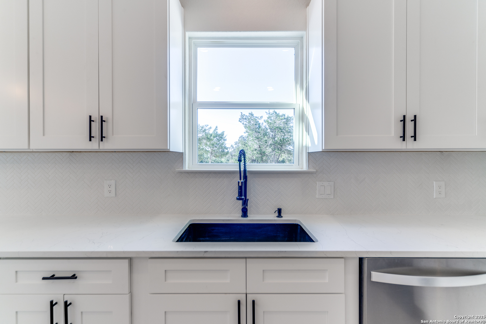 2962 Contour Drive Spring Branch, TX 78070 - Photo 11 of 26 a sink with white cabinets
