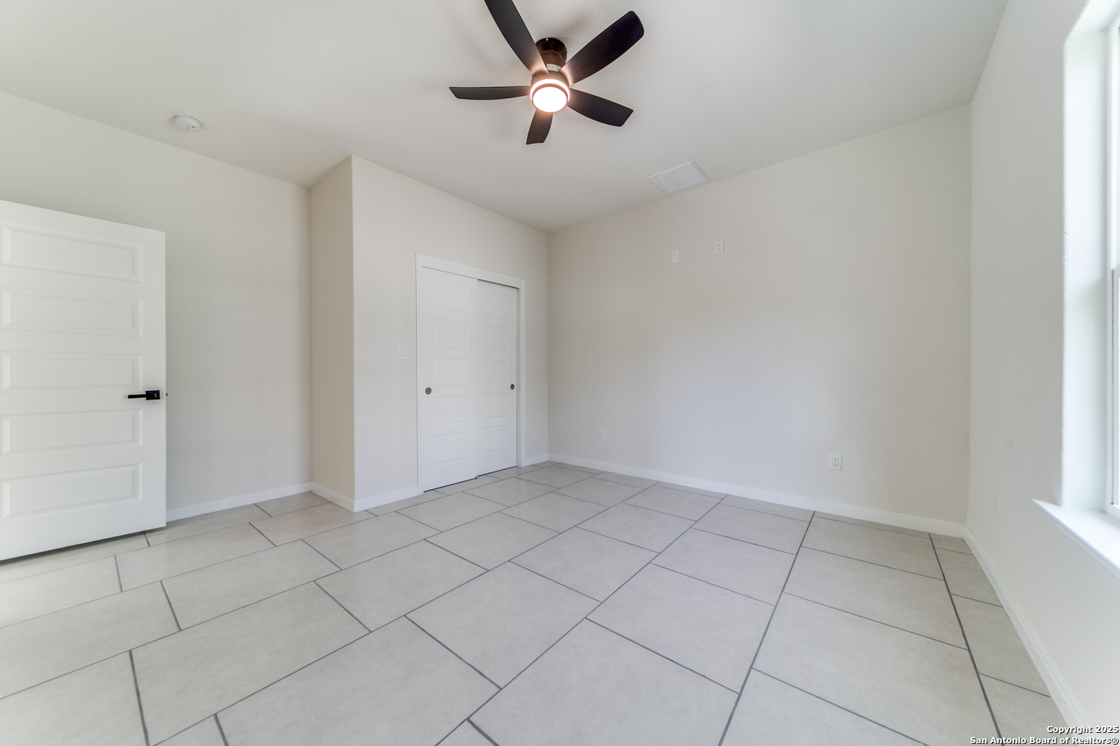 2962 Contour Drive Spring Branch, TX 78070 - Photo 16 of 26 wooden floor in an empty room with a window