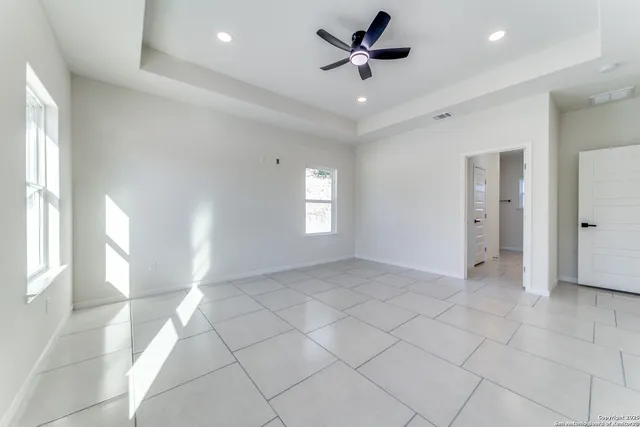 a bathroom with double vanity sinks and a mirror