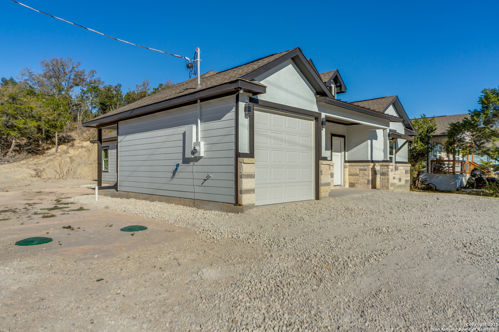 2962 Contour Drive Spring Branch, TX 78070 - Photo 3 of 26 front view of a house with a yard