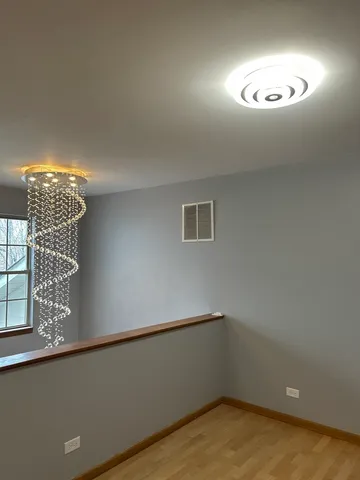 a kitchen with stainless steel appliances white cabinets and a stove