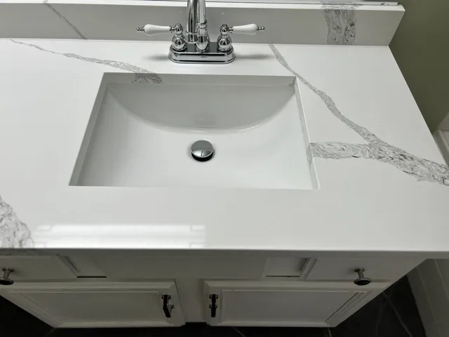 a view of staircase with white walls