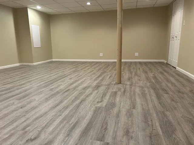 a view of a house with a small deck