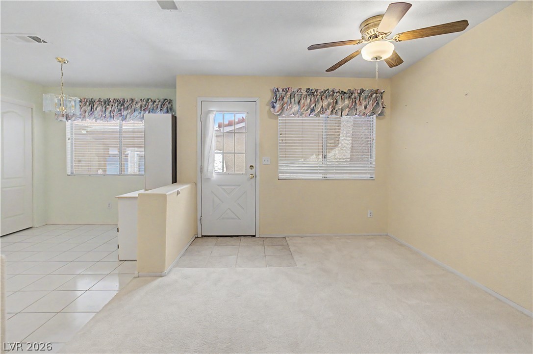 2243 Rugged Mesa Drive Laughlin, NV 89029 - Photo 30 of 32 A versatile living space with plush carpeting, tile flooring, and ample natural light.