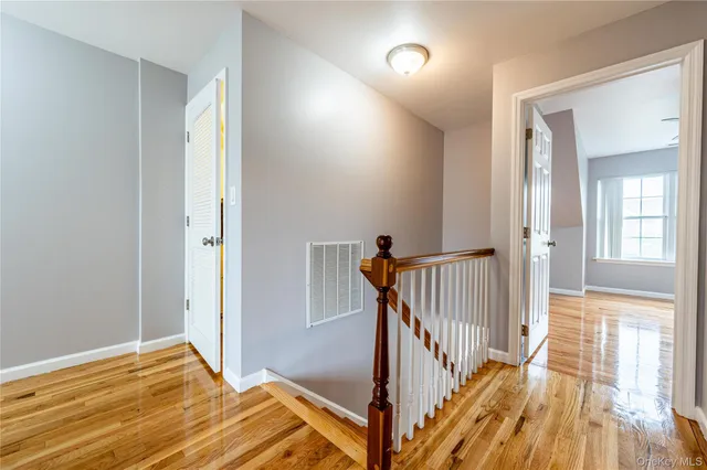 a view of bedroom with wooden floor