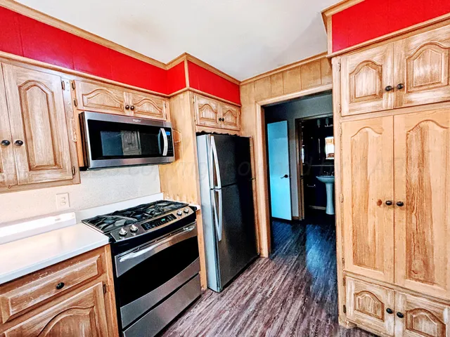 a view of kitchen with wooden floor