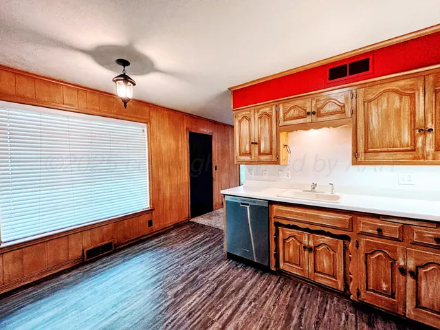 a view of a room with wooden floor