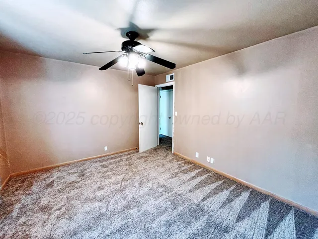 a large bathroom with a double vanity sink a mirror and a toilet
