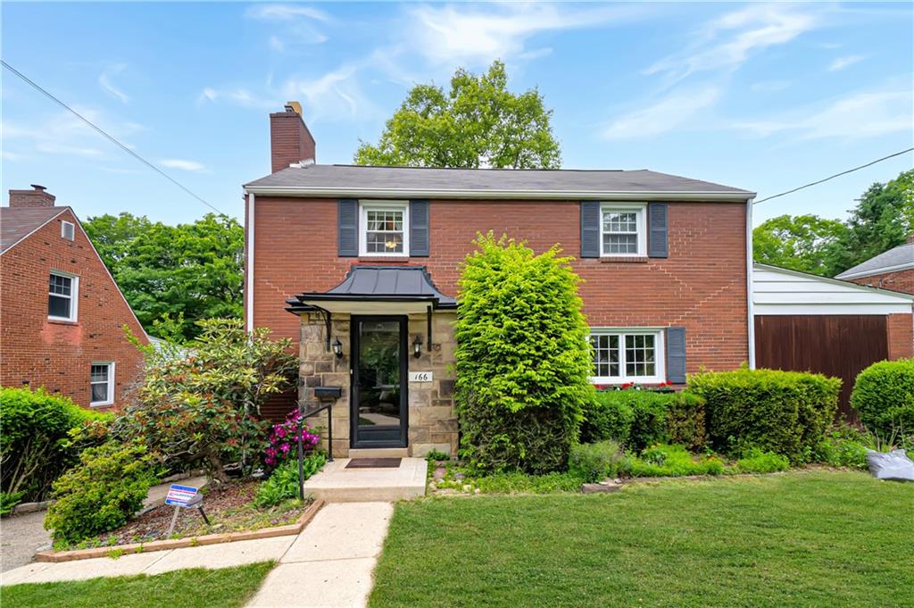 166 Spring Grove Road Pittsburgh, PA 15235 - Photo 1 of 41 front view of a house with a yard