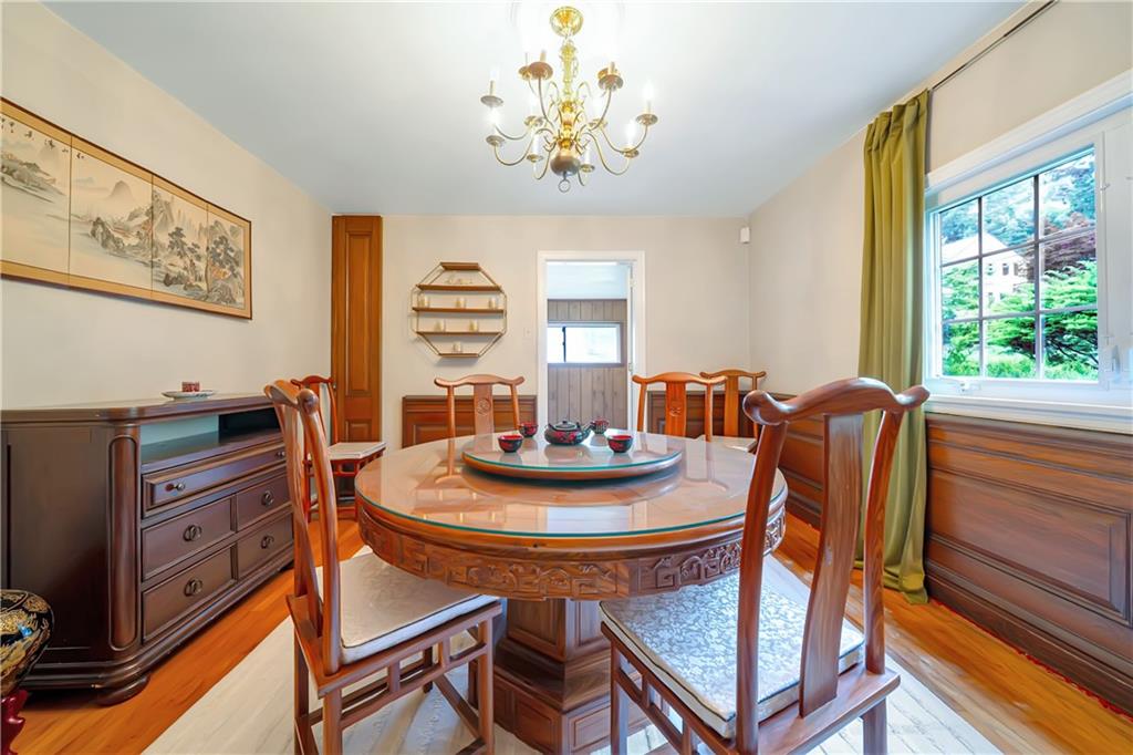 166 Spring Grove Road Pittsburgh, PA 15235 - Photo 12 of 41 a dining room with furniture a chandelier and a window