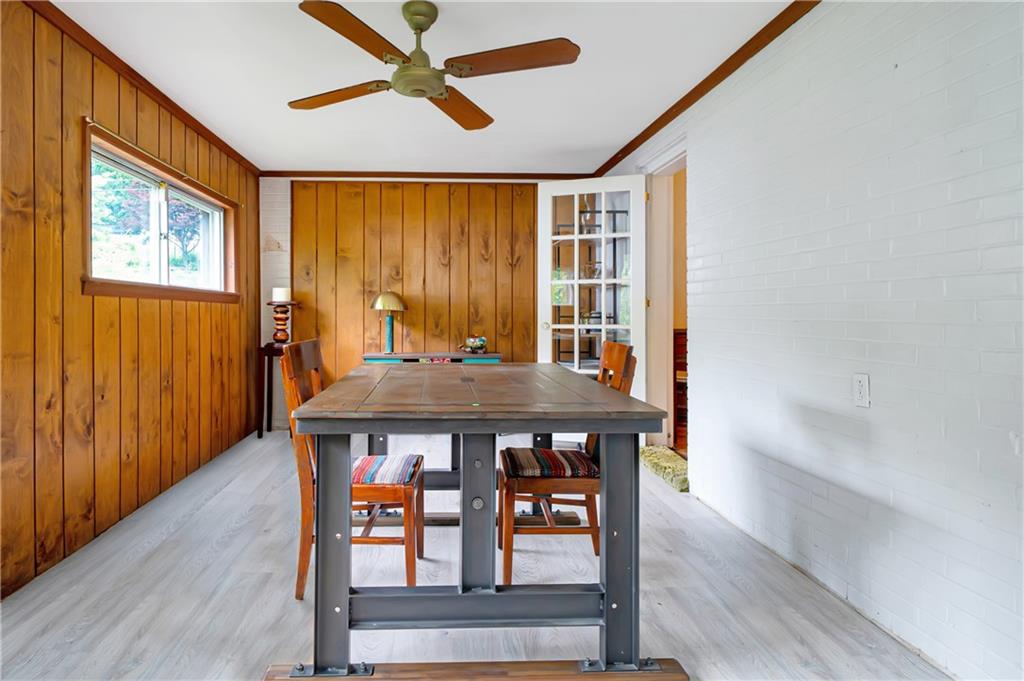 166 Spring Grove Road Pittsburgh, PA 15235 - Photo 14 of 41 a view of a dining room with furniture window and wooden floor