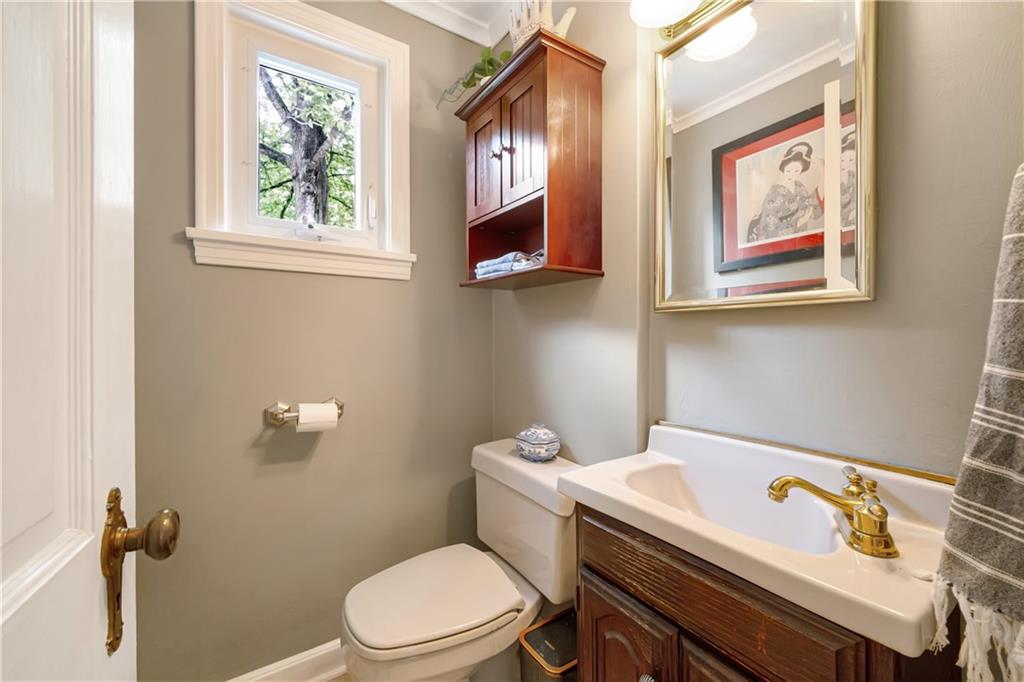 166 Spring Grove Road Pittsburgh, PA 15235 - Photo 18 of 41 a bathroom with a toilet a sink and mirror