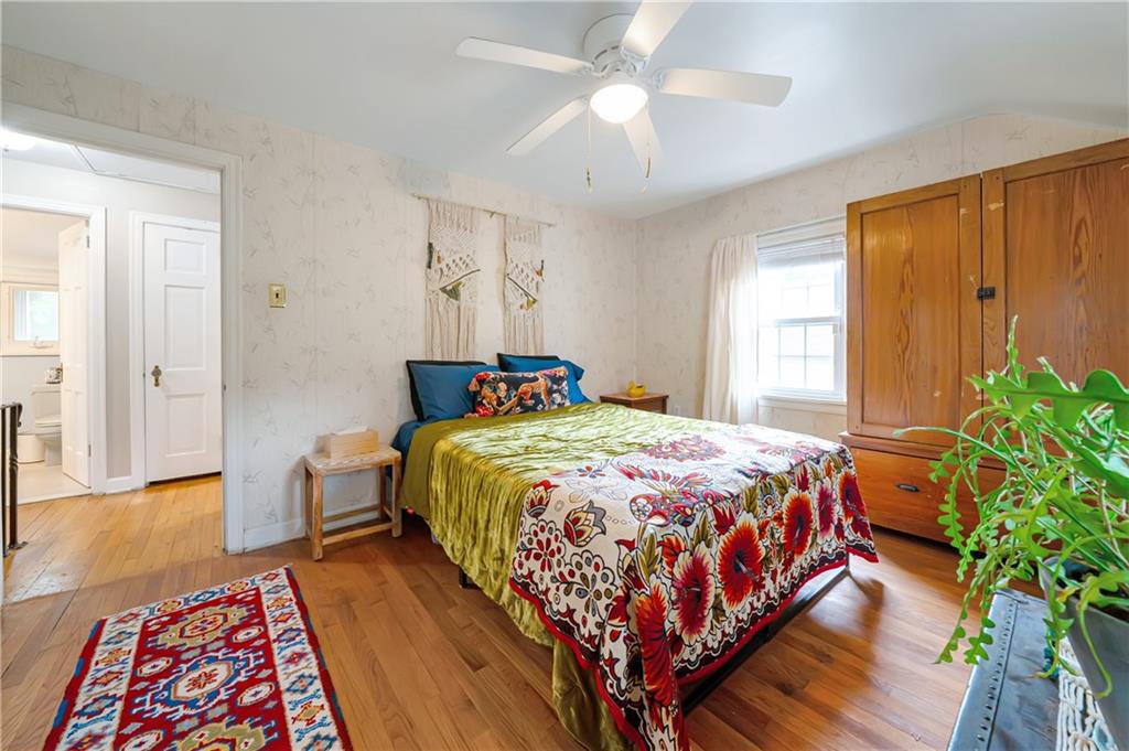 166 Spring Grove Road Pittsburgh, PA 15235 - Photo 23 of 41 a bedroom with a bed table and a window