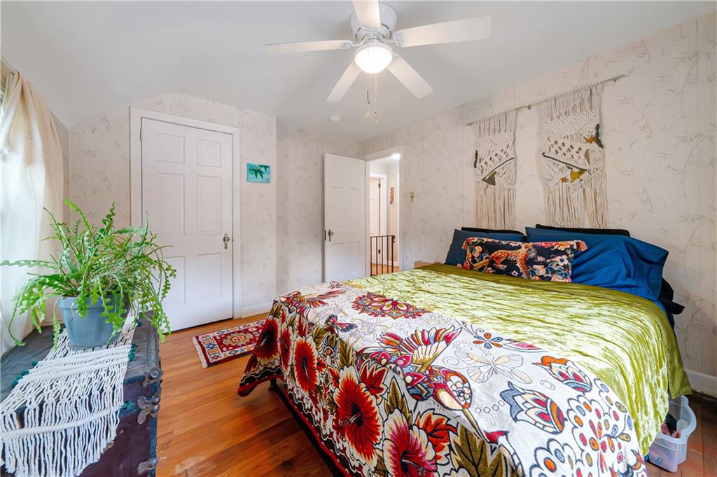 166 Spring Grove Road Pittsburgh, PA 15235 - Photo 24 of 41 a bedroom with bed and a potted plant