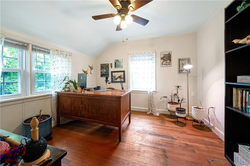 166 Spring Grove Road Pittsburgh, PA 15235 - Photo 25 of 41 a room with furniture a window and a flat screen tv