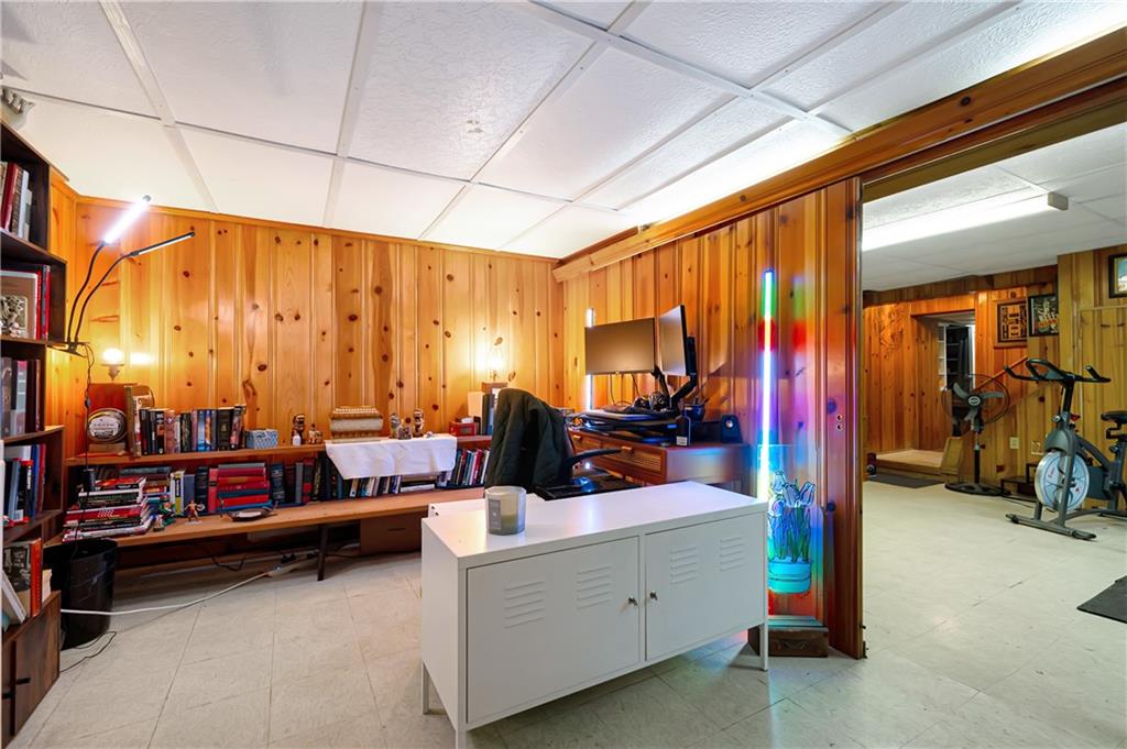 166 Spring Grove Road Pittsburgh, PA 15235 - Photo 30 of 41 a view of living room with furniture and a flat screen tv