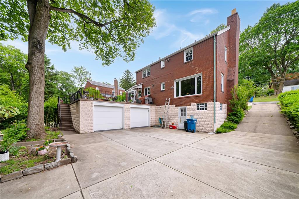 166 Spring Grove Road Pittsburgh, PA 15235 - Photo 32 of 41 a front view of a house with garage