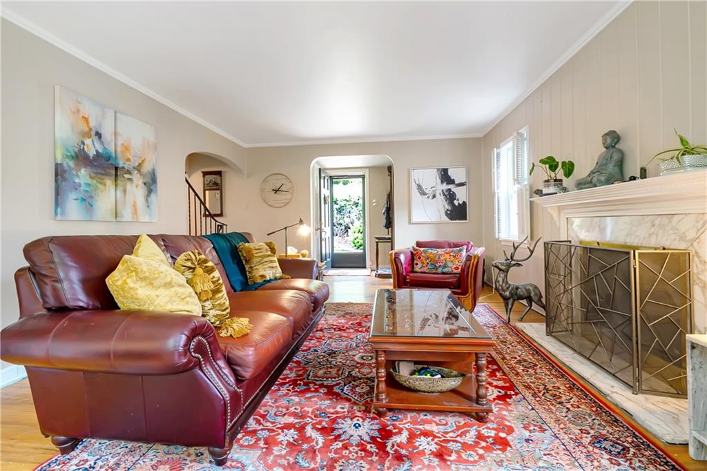 166 Spring Grove Road Pittsburgh, PA 15235 - Photo 4 of 41 a living room with furniture or couch and a fireplace