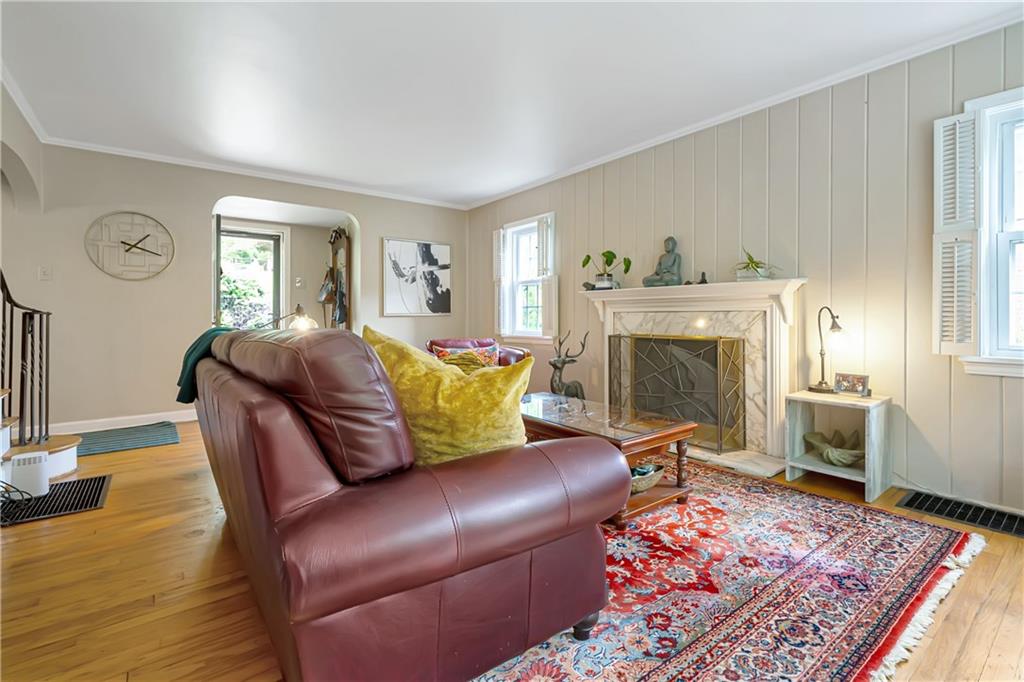 166 Spring Grove Road Pittsburgh, PA 15235 - Photo 7 of 41 a living room with furniture and a fireplace