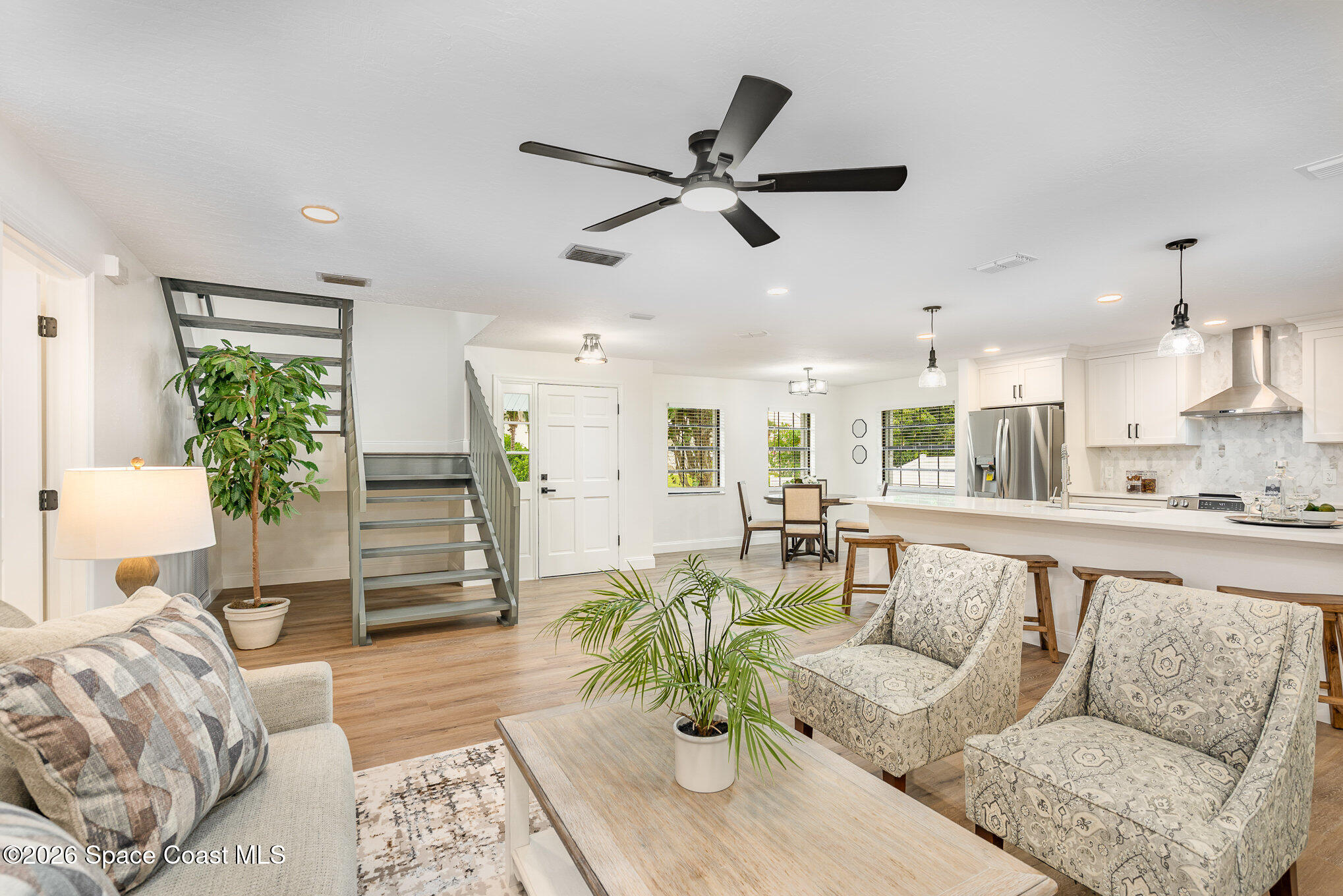 362 Nikomas Way Melbourne Beach, FL 32951 - Photo 3 of 32 a living room with furniture and a large window