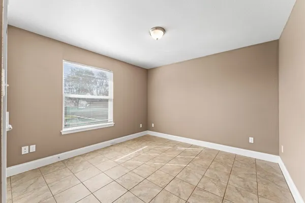 a view of a house with a car park front of a house